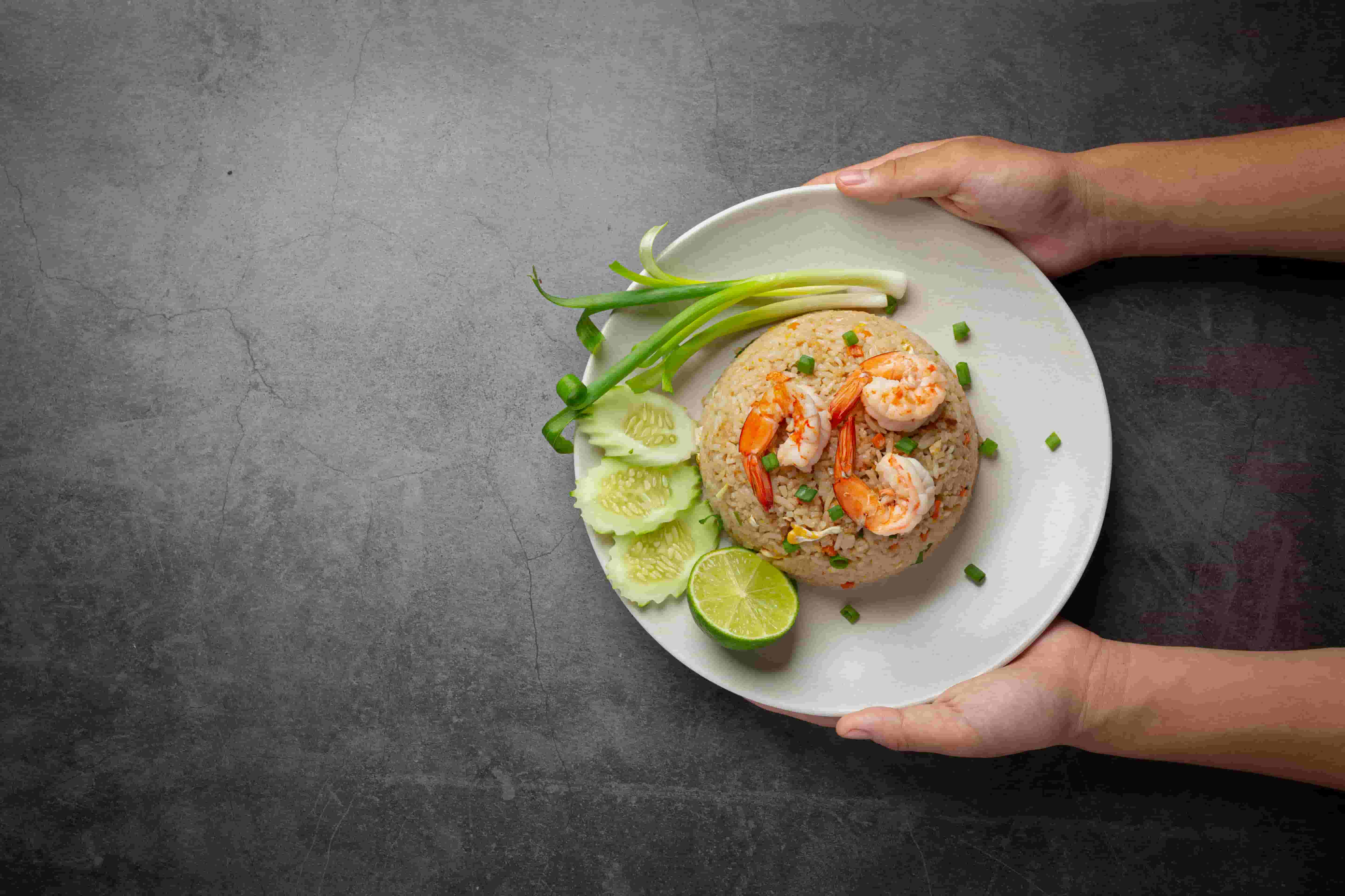 Chef preparing authentic Thai cuisine (อาหารไทย) at Suk Jai Thai